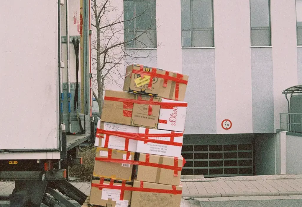 Removal truck being loaded with boxes in Ealing