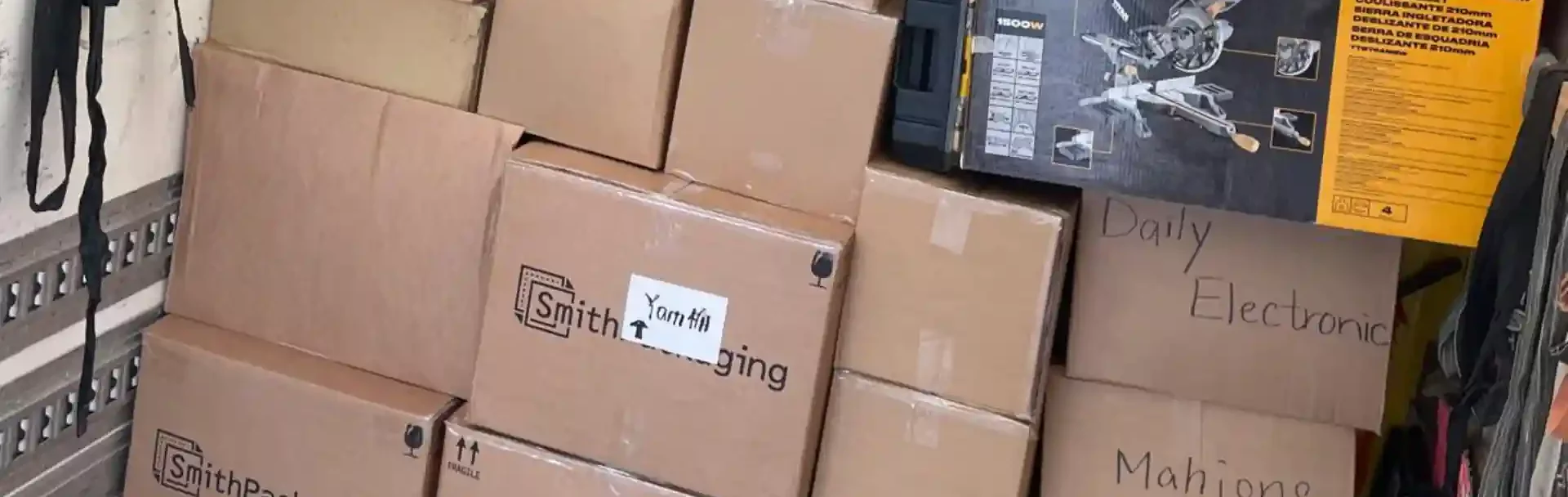 Professional man and van Wembley movers handling boxes carefully