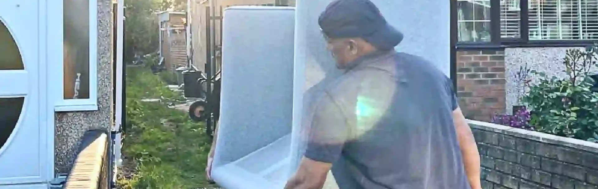 Professional man and van Wembley movers handling boxes carefully