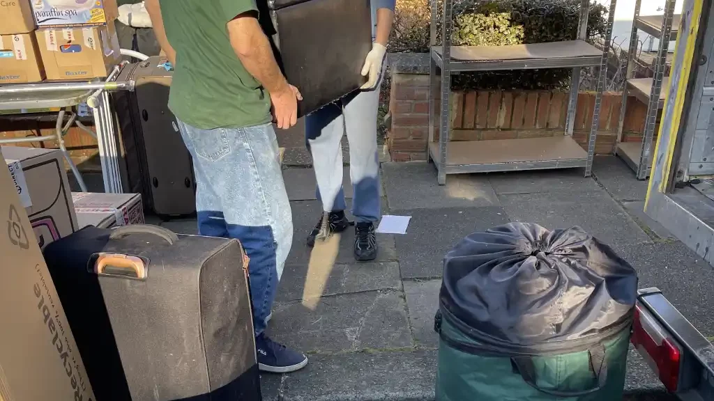 One Step Removals man and van loading furniture into the van