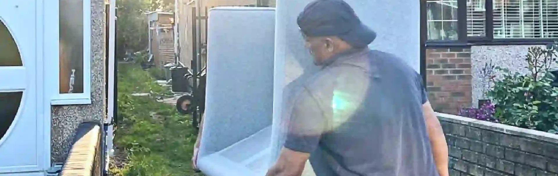 Professional man and van Wembley movers handling boxes carefully