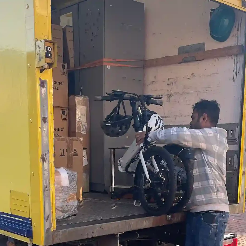 Experienced movers loading furniture into a removal van at a family home